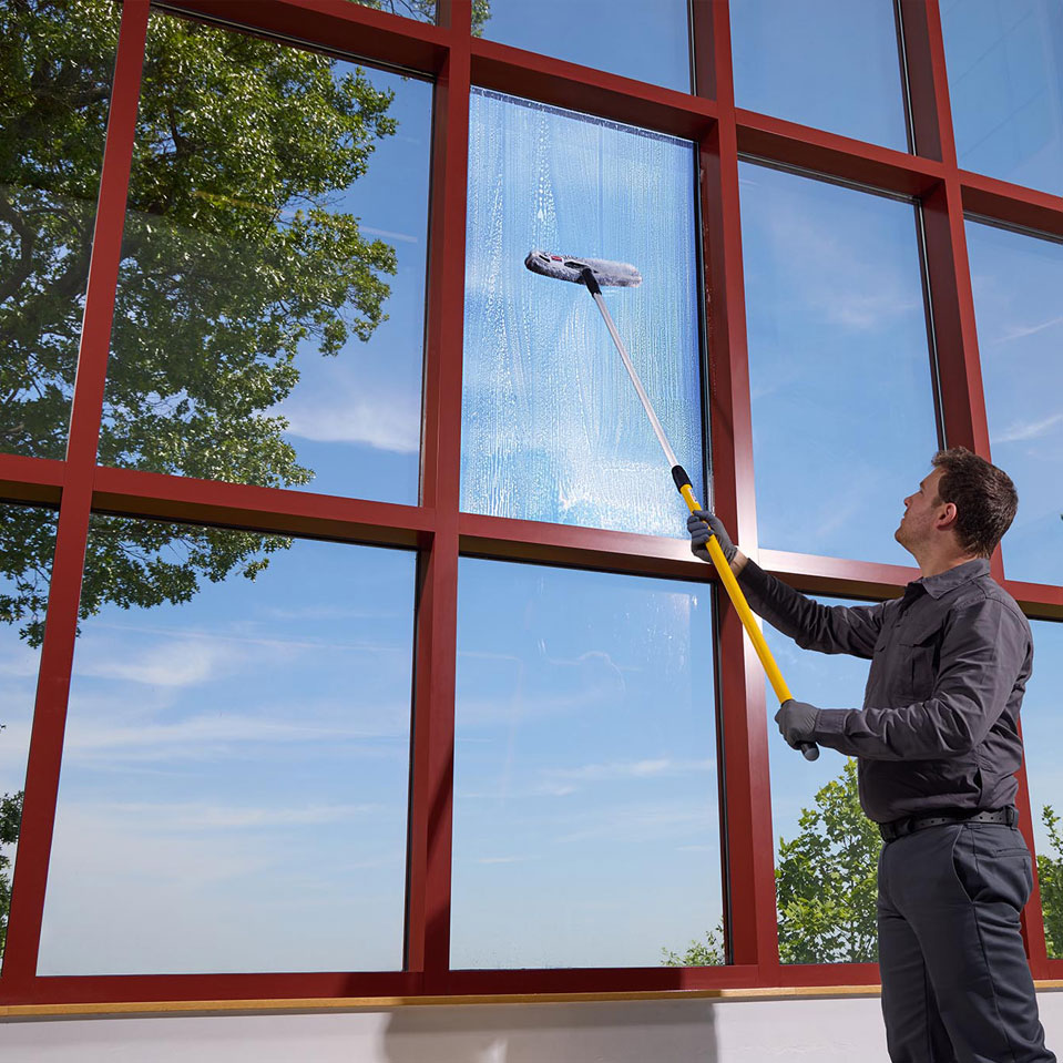 Man cleaning glass